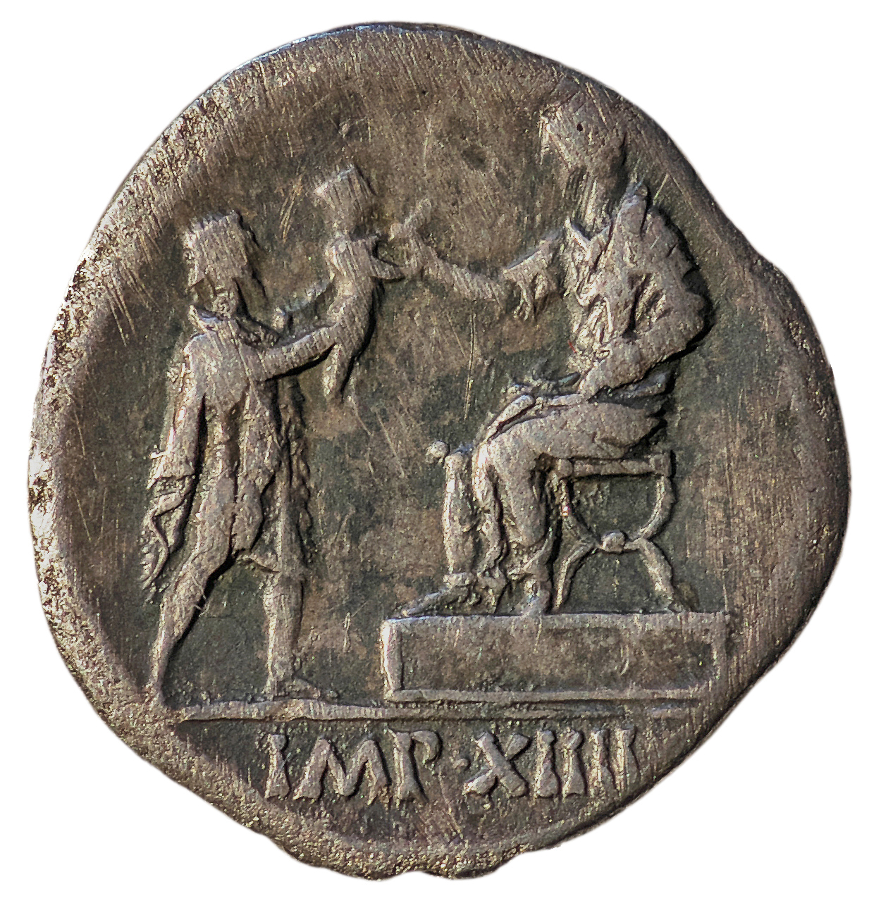 Augustus reverse — Augustus, togate, seated left on platform, receiving child from standing barbarian