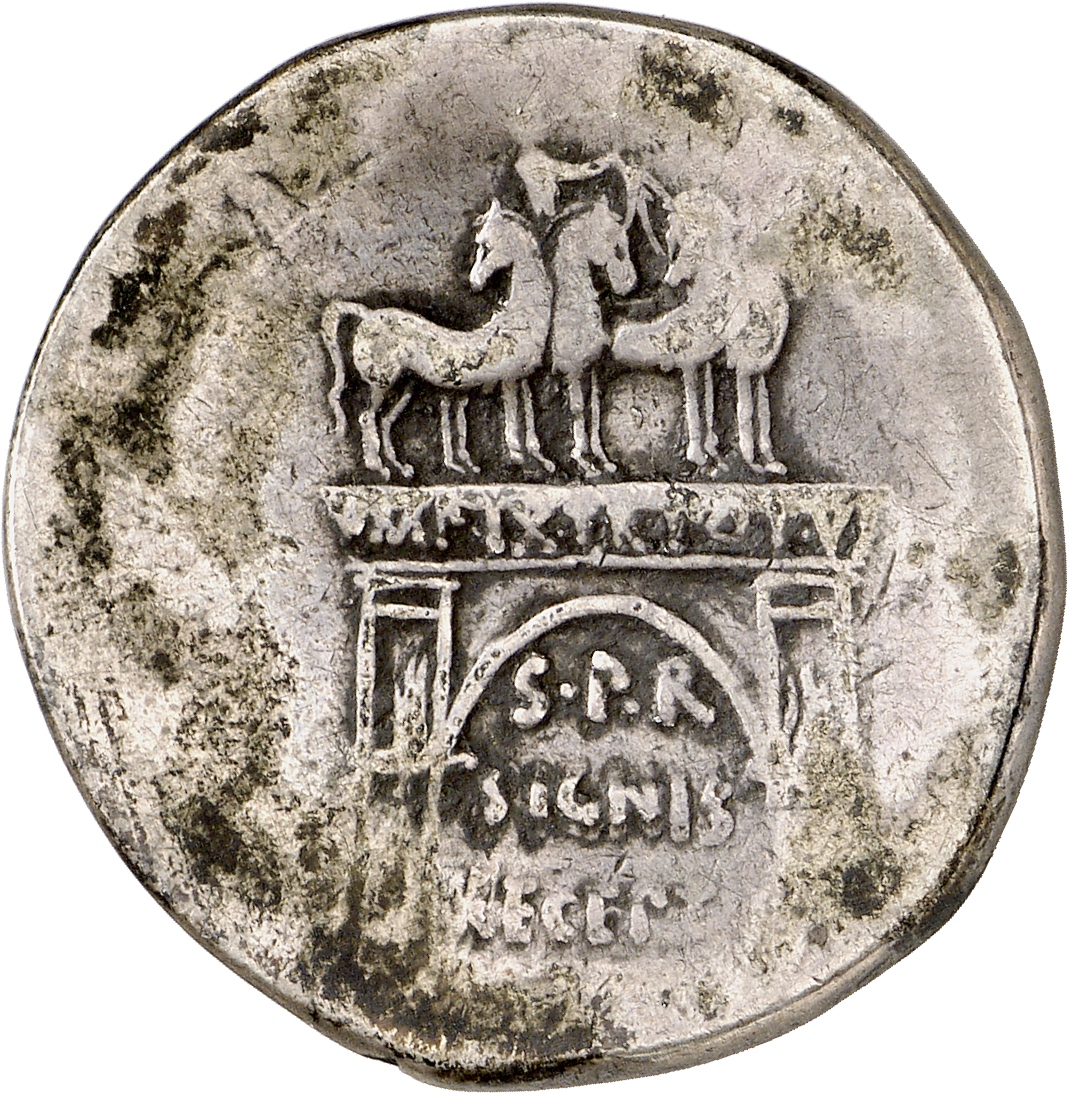 Augustus reverse — Triumphal arch inscribed IMP IX TR POT V surmounted by charioteer in quadriga; flanked by aquilas