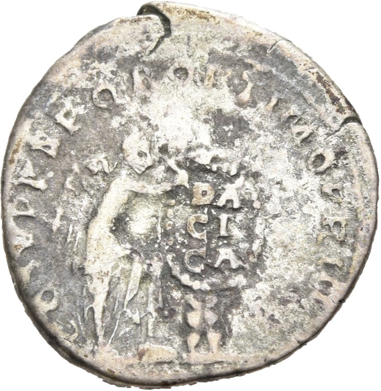 RIC II Trajan 130 Trajan reverse, Victory, naked to hips, standing right, left foot set on a step, inscribing DACICA on sh...