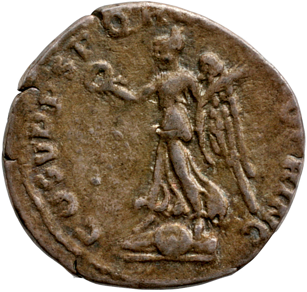 RIC II Trajan 131 Trajan reverse, Victory, draped, walking left over a round and oblong shield, holding up wreath in right...