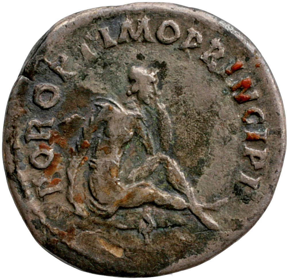 Trajan reverse — Dacian, in attitude of mourning, seated right on oval shield; sword below
