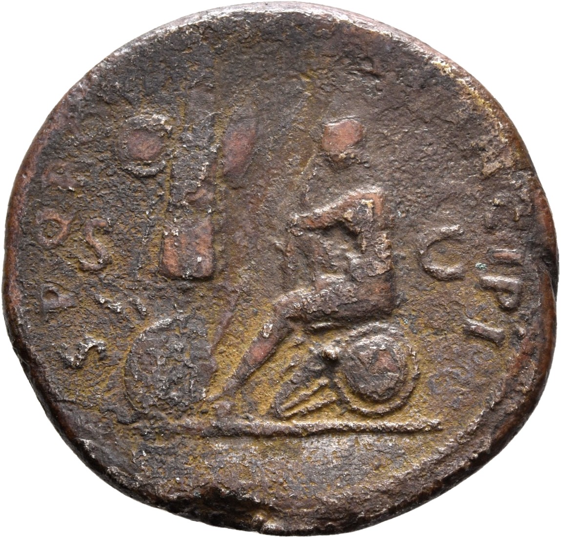 RIC II Trajan 562 Trajan reverse, Dacia, seated left, in attitude of mourning on shield and pile of arms; before her on le...