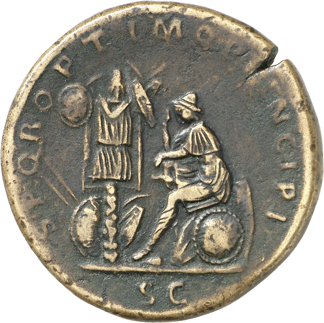 RIC II Trajan 564 Trajan reverse, Dacia, seated left, in attitude of mourning on shield and pile of arms; before her on le...