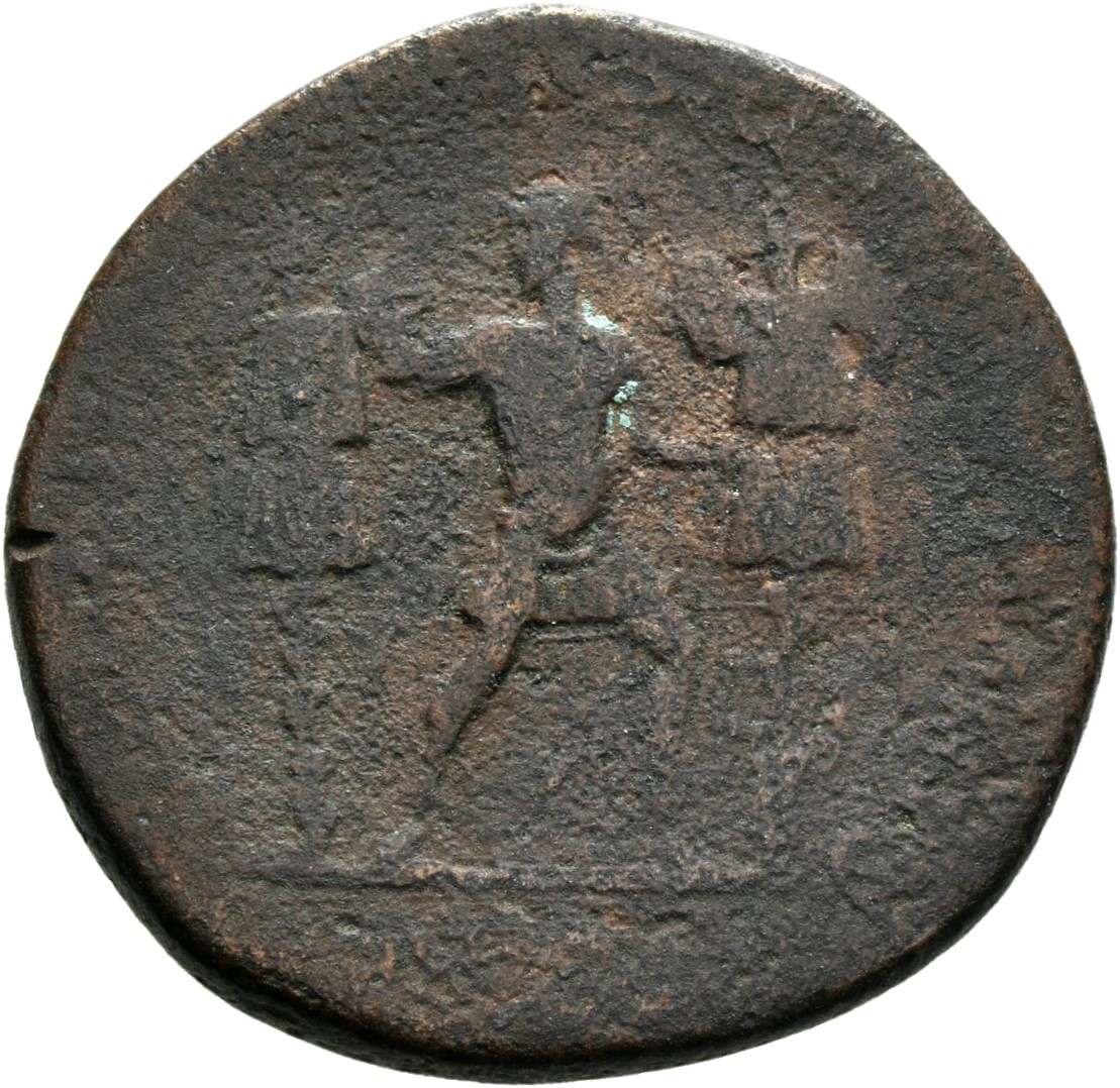 RIC II Trajan 676 Trajan reverse, Trajan, in military dress, standing front, head left, striding between two trophies, lef...
