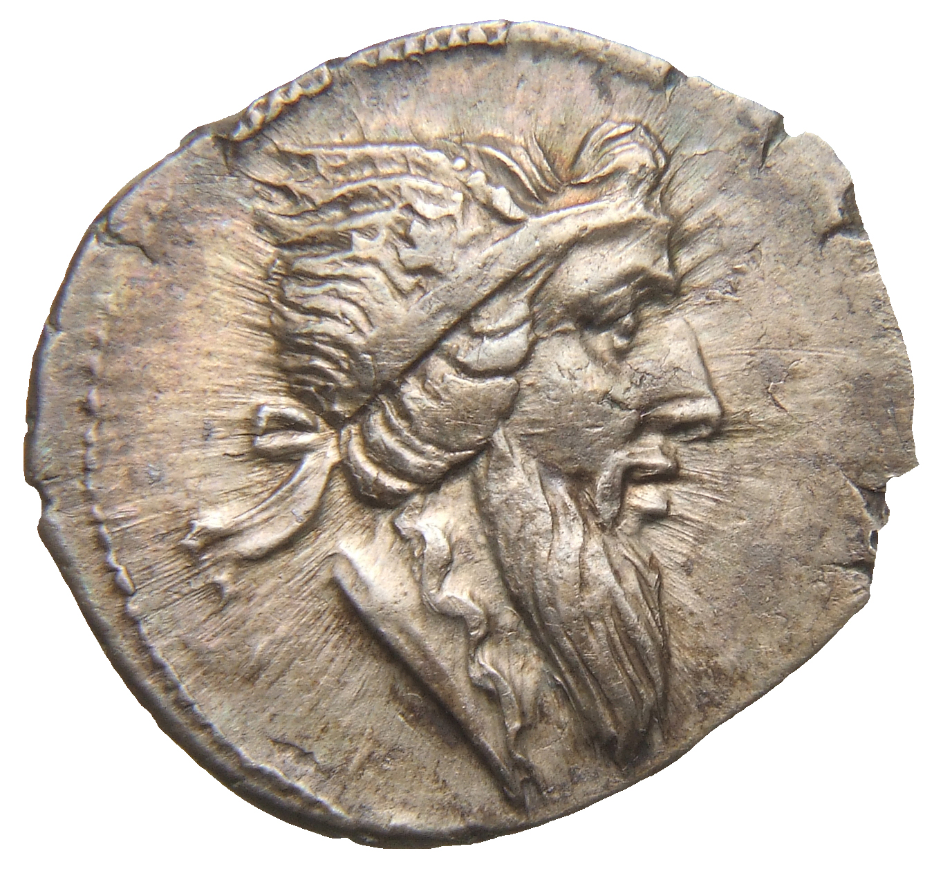 RIC II Trajan 776 Trajan obverse, Head of Mutinus Titinus, bearded, right?