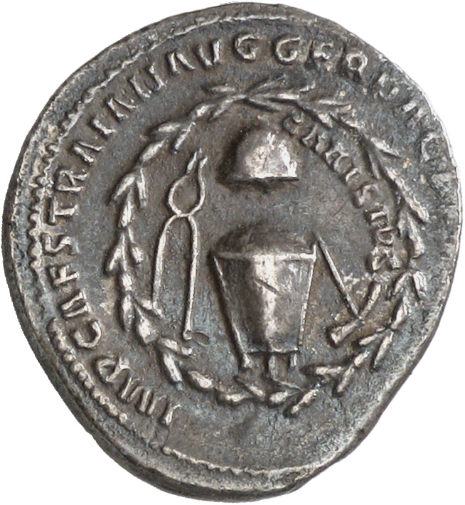 RIC II Trajan 805 Trajan reverse, Anvil, between tongs and hammer; above, cap of Vulcan; the whole in laurel wreath
