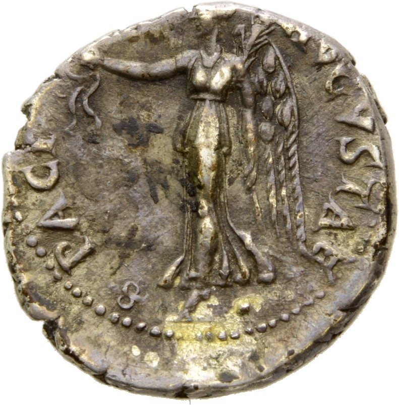 Vespasian reverse — Victory, draped, advancing left, holding wreath in extended right hand and palm in left hand