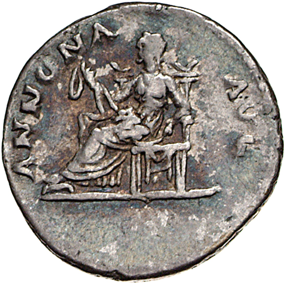 Vespasian reverse — Annona, draped, seated left on throne, feet on stool, holding on her lap a sack of corn-ears open, holding the ties in her hands