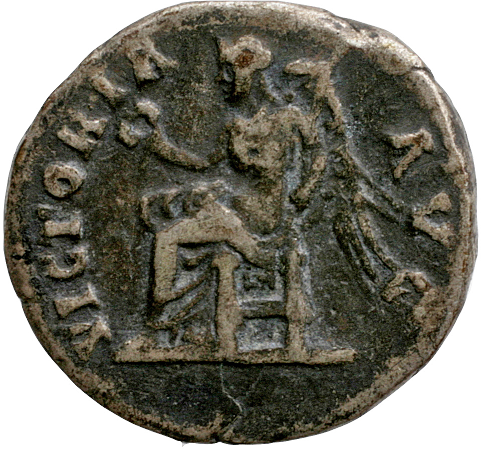 Hadrian reverse — Victory seated left, holding wreath and palm