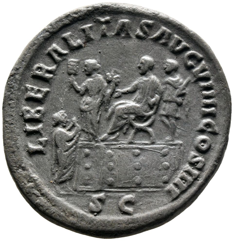RIC III Antoninus Pius 1044 Antoninus Pius reverse, Antoninus Pius, seated left on platform on right; behind him, officer,...