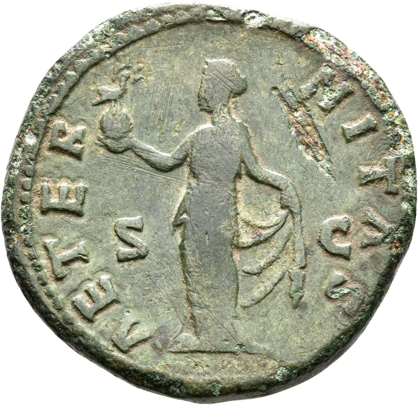 RIC III Antoninus Pius 1105a Antoninus Pius reverse, Aeternitas, draped, standing left, holding phoenix (nimbate right) on...