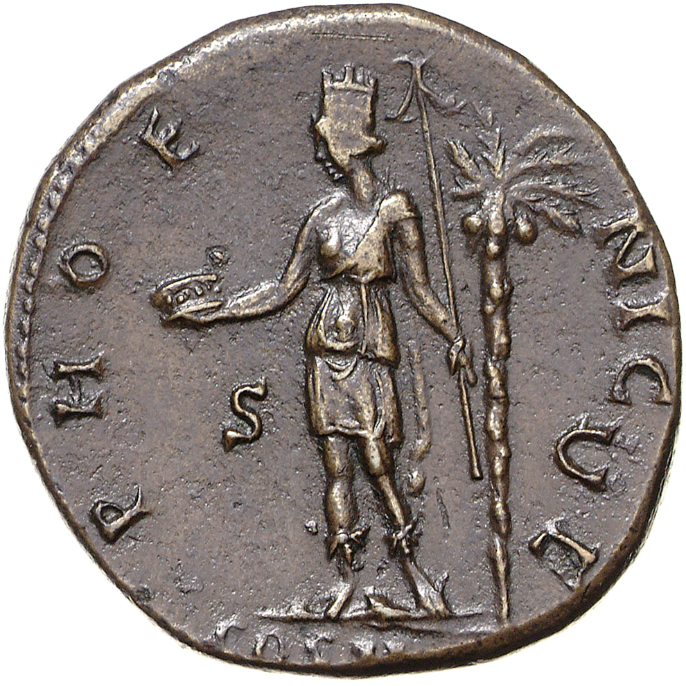 Antoninus Pius reverse — Phoenicia, towered, standing left, holding crown in right hand and short sceptre in left; by left foot, prow; to right, palm-tree