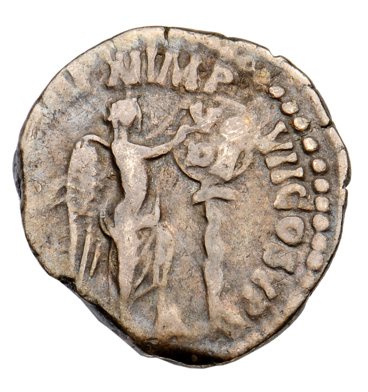 RIC III Commodus 136d Commodus reverse, Victory, winged, half-draped, standing right with foot set on helmet, and fixing t...