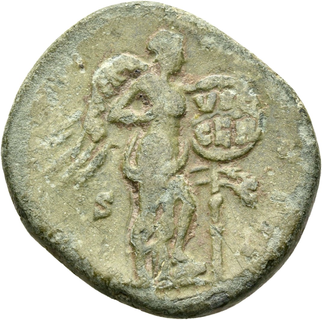 RIC III Marcus Aurelius 1031 Marcus Aurelius reverse, Victory, winged, naked to waist, standing right, placing with left h...