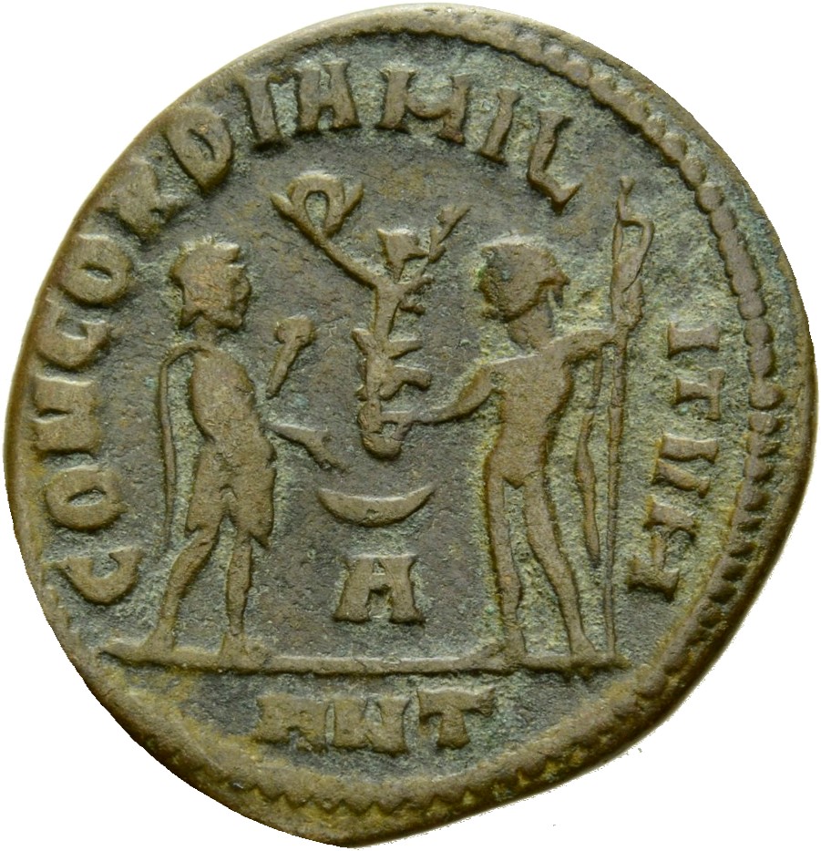 RIC VI Antioch 62b Diocletian reverse, Maximian, draped, cuirassed, standing right, receiving small Victory on globe from ...