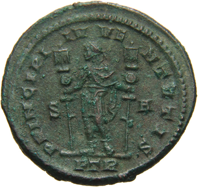 RIC VI Treveri 734 Constantine I reverse, Constantine I, draped, cuirassed, standing front, head left, holding standard in...