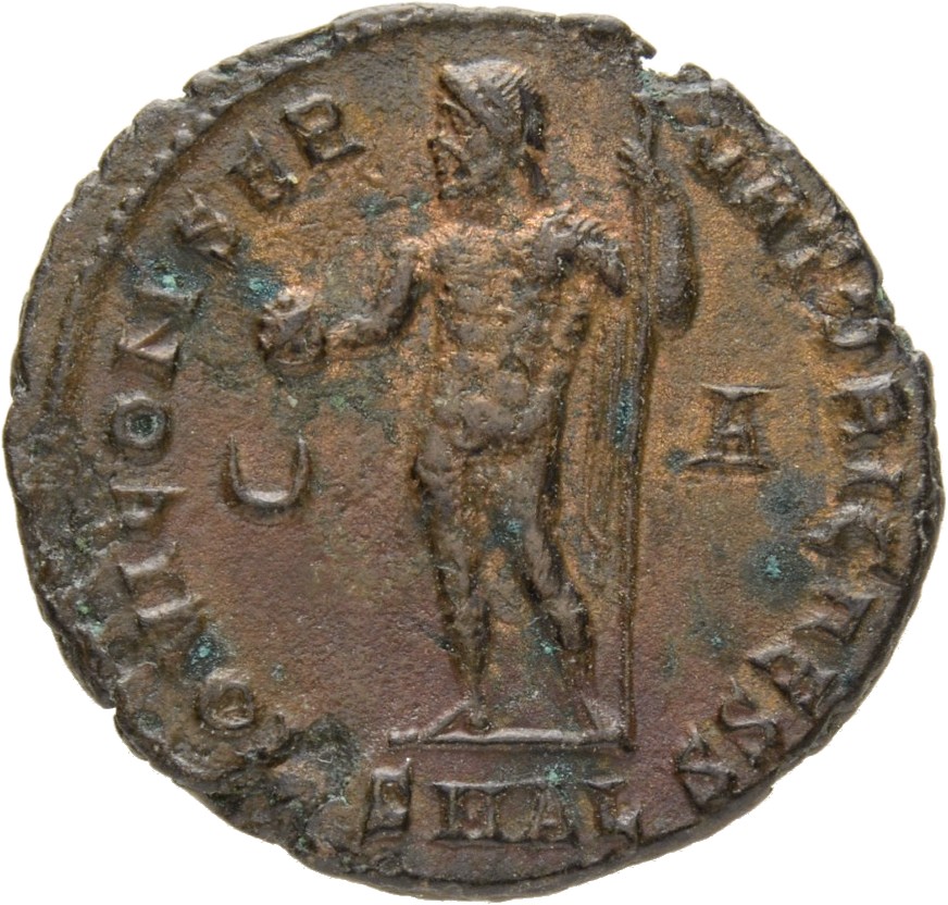 RIC VII Alexandria 26 Licinius reverse, Jupiter, nude, chlamys spread, standing left, holding globe in right hand and lean...