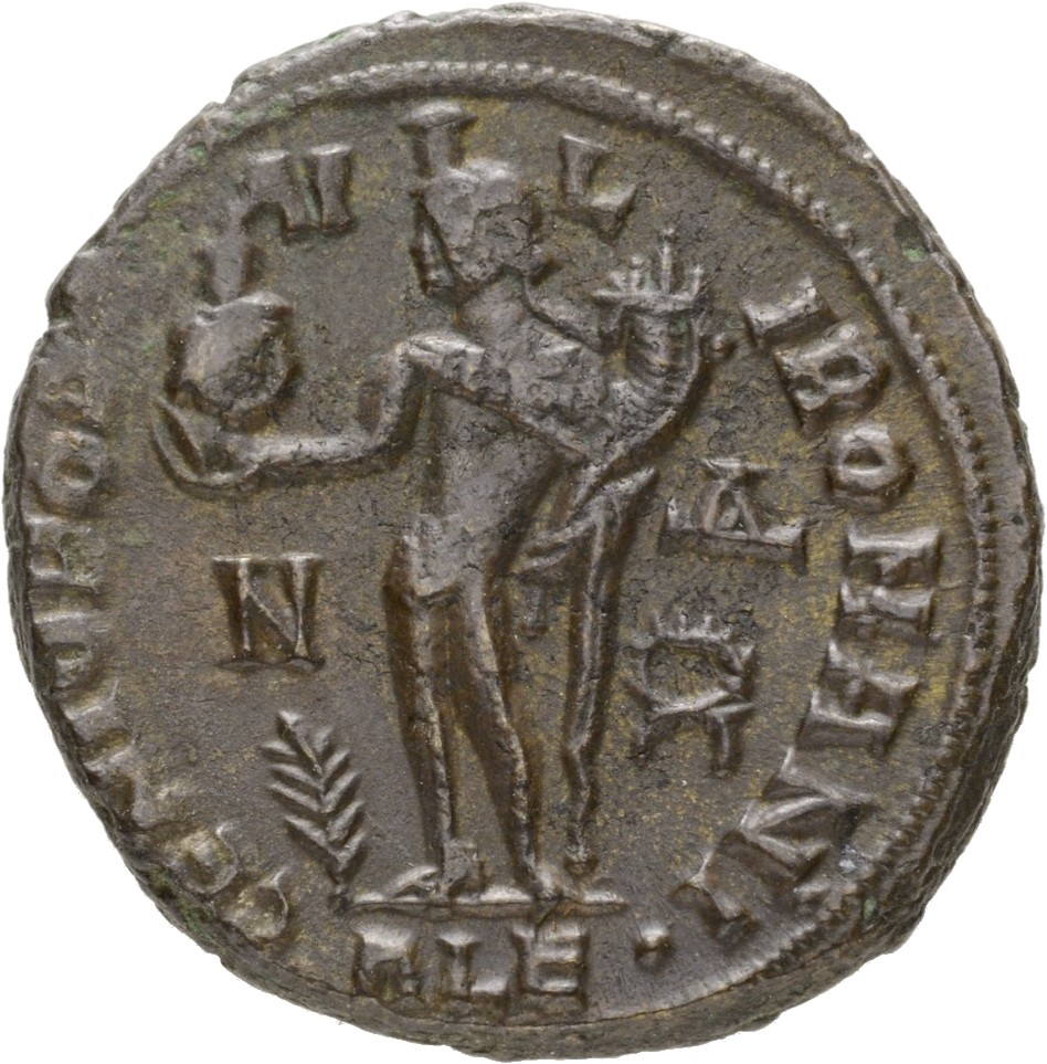 RIC VII Alexandria 5 Licinius reverse, Genius, wearing modius, chlamys draped across left shoulder, standing left, holding...