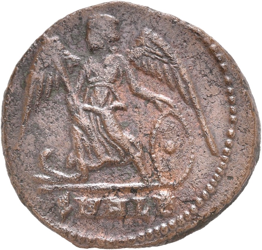 Constantine I reverse — Victory, winged, draped, standing left on prow, holding spear in right hand and shield in left hand