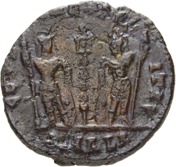 RIC VII Alexandria 67 Constantine I reverse, Two soldiers, helmeted, draped, cuirassed, standing facing each other, each h...