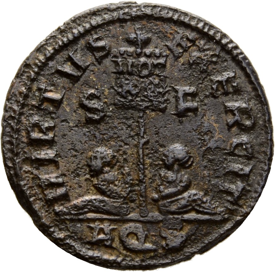 Constantine I reverse — Standard inscribed VOT/XX flanked by two seated captives
