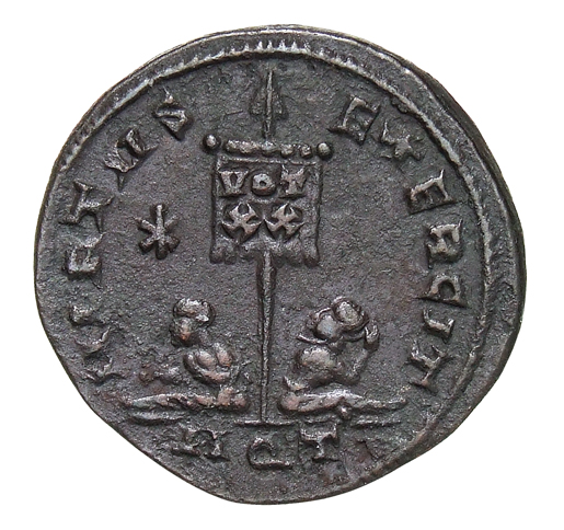 Constantine I reverse — Standard inscribed VOT/XX flanked by two seated captives