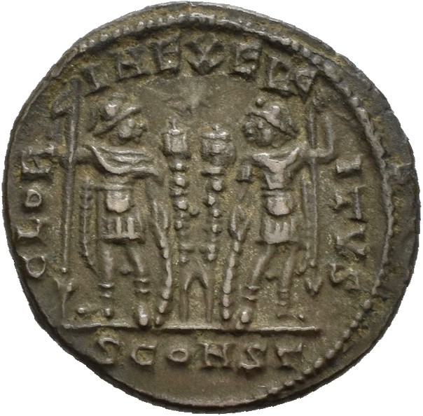 RIC VII Arelate 350 Constantine I reverse, Two soldiers, helmeted, draped, cuirassed, standing facing each other, each hol...