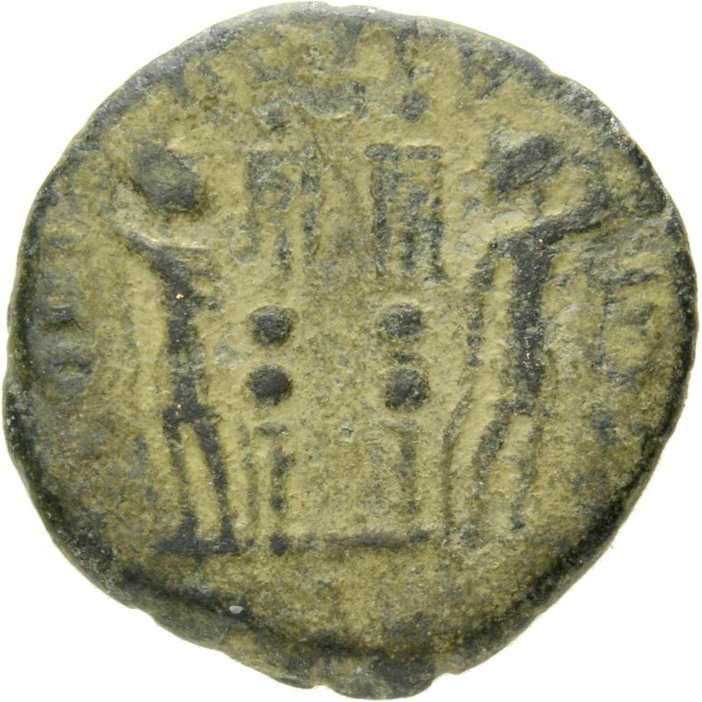 Constantine I reverse — Two soldiers, helmeted, draped, cuirassed, standing facing each other, each holding spear in outer hand and resting inner hand on shield; between them, two standards