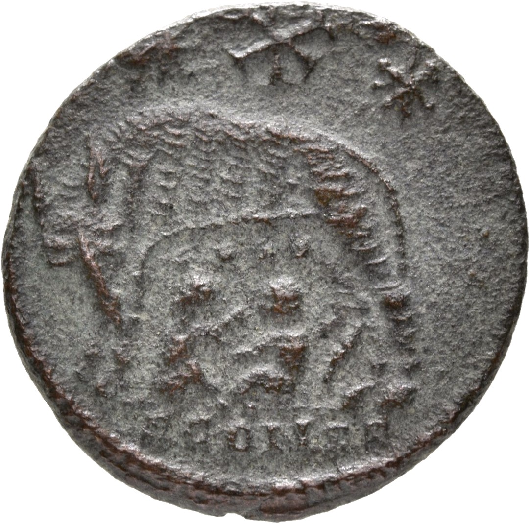 Constantine I reverse — She-wolf, standing left, suckling twins; above, two stars