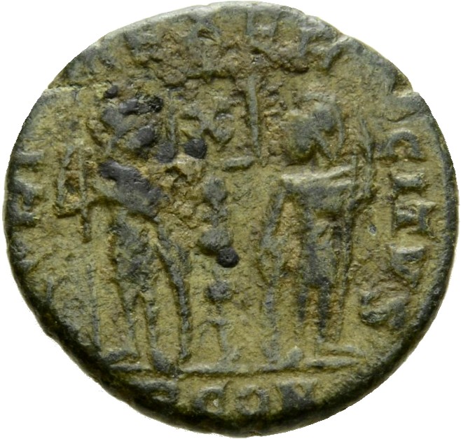 RIC VII Arelate 402 Constantine I reverse, Two soldiers, helmeted, draped, cuirassed, standing facing each other, each hol...