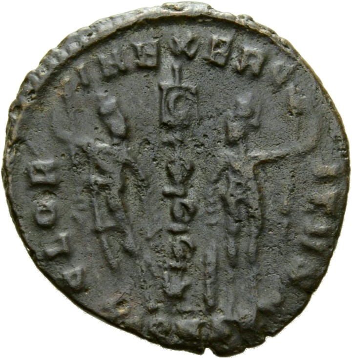 Constantine I reverse — Two soldiers, helmeted, draped, cuirassed, standing facing each other, each holding reversed spear in outer hand and resting inner hand on shield; between them, a standard