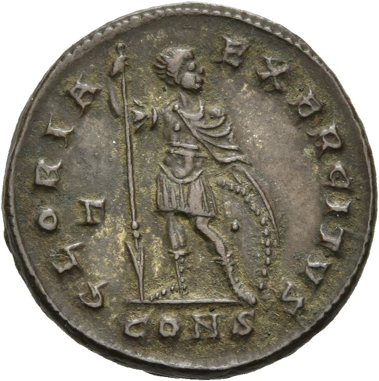 RIC VII Constantinople 22 Constantine I reverse, Soldier, draped, cuirassed, standing left, head right, holding reversed s...
