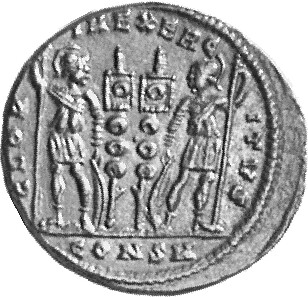 Constantine I reverse — Two soldiers, helmeted, draped, cuirassed, standing facing each other, each holding reversed spear in outer hand and resting inner hand on shield; between them, two standards