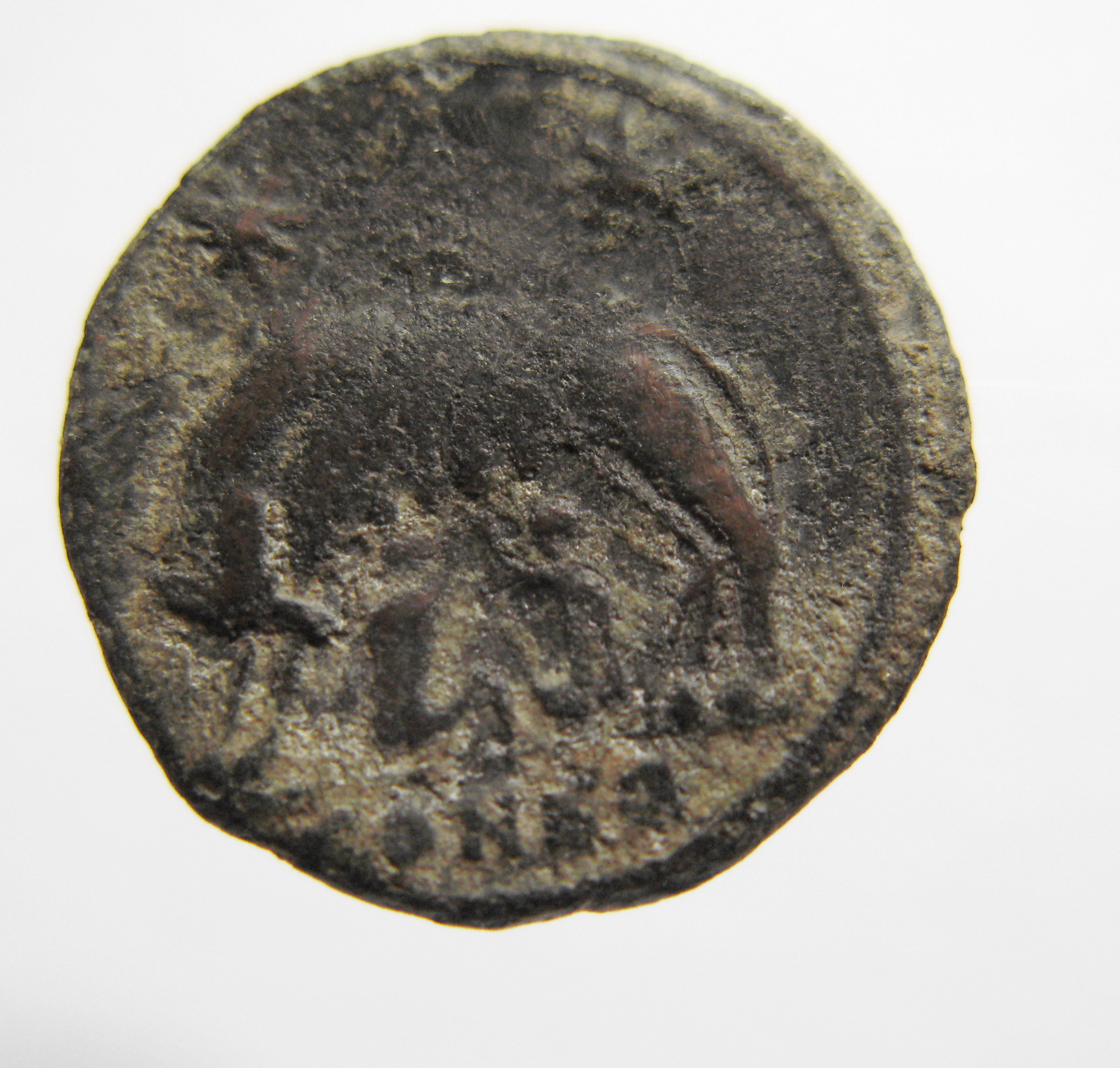 Constantine I reverse — She-wolf, standing left, suckling twins; above, two stars