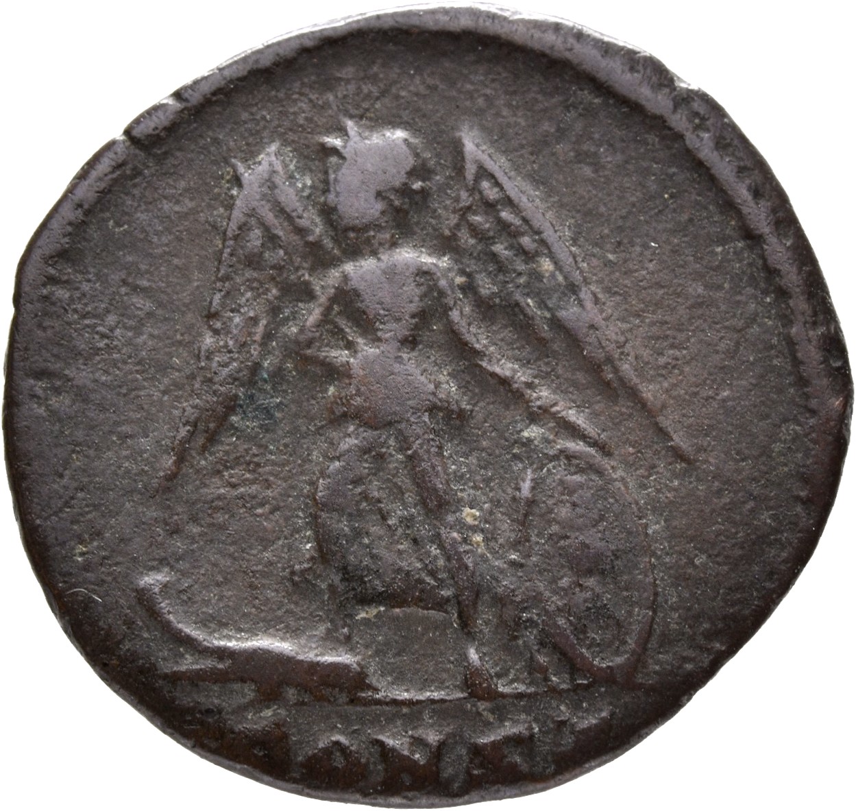 Constantine I reverse — Victory, winged, draped, standing left on prow, holding spear in right hand and shield in left hand