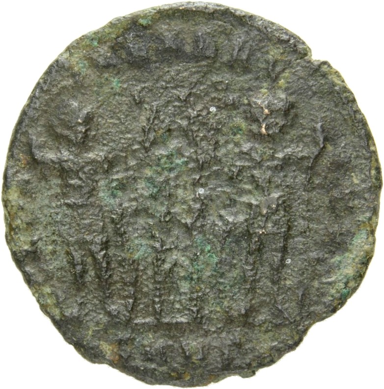 Constantine I reverse — Two soldiers, helmeted, draped, cuirassed, standing facing each other, each holding reversed spear in outer hand and resting inner hand on shield; between them, two standards
