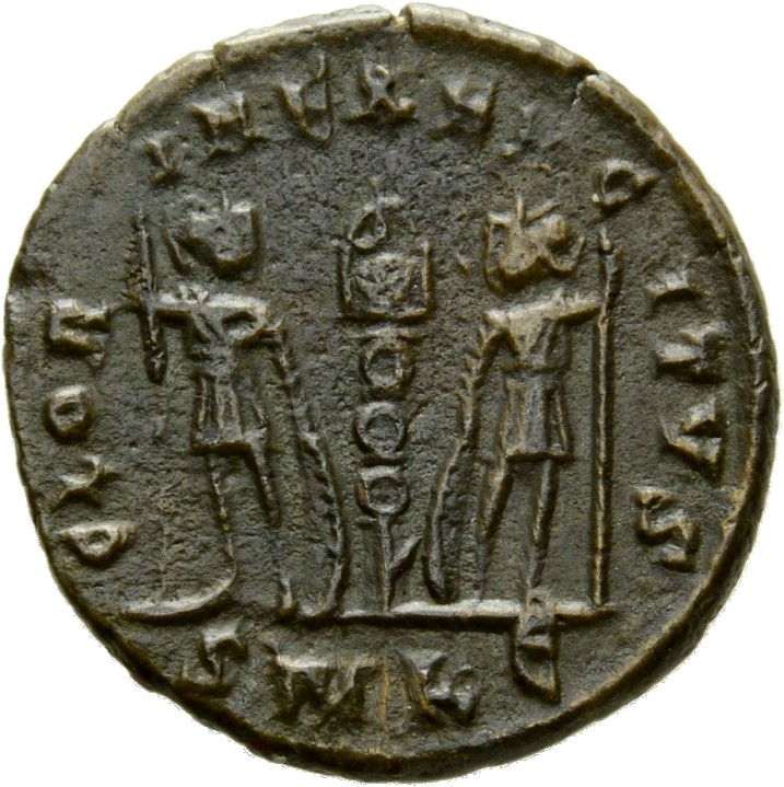 Constantine I reverse — Two soldiers, helmeted, draped, cuirassed, standing facing each other, each holding spear in outer hand and resting inner hand on shield; between them, a standard