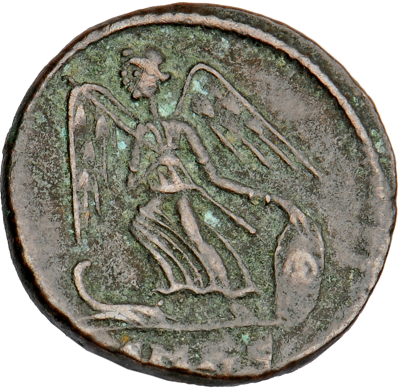 Constantine I reverse — Victory, winged, draped, standing left on prow, holding spear in right hand and shield in left hand