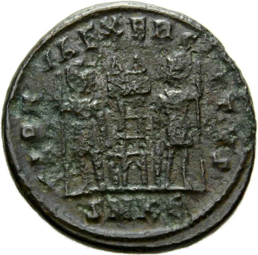 Constantine I reverse — Two soldiers, helmeted, draped, cuirassed, standing facing each other, each holding spear in outer hand and resting inner hand on shield; between them, two standards