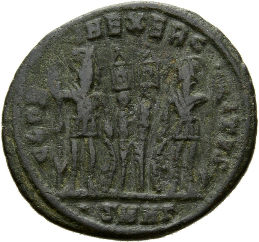 Constantine I reverse — Two soldiers, helmeted, draped, cuirassed, standing facing each other, each holding spear in outer hand and resting inner hand on shield; between them, two standards