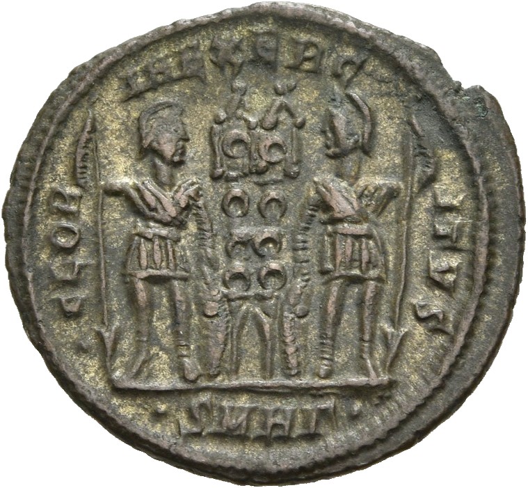 RIC VII Heraclea 123 Constantine I reverse — Two soldiers, helmeted, draped, cuirassed, standing facing each other, each h...