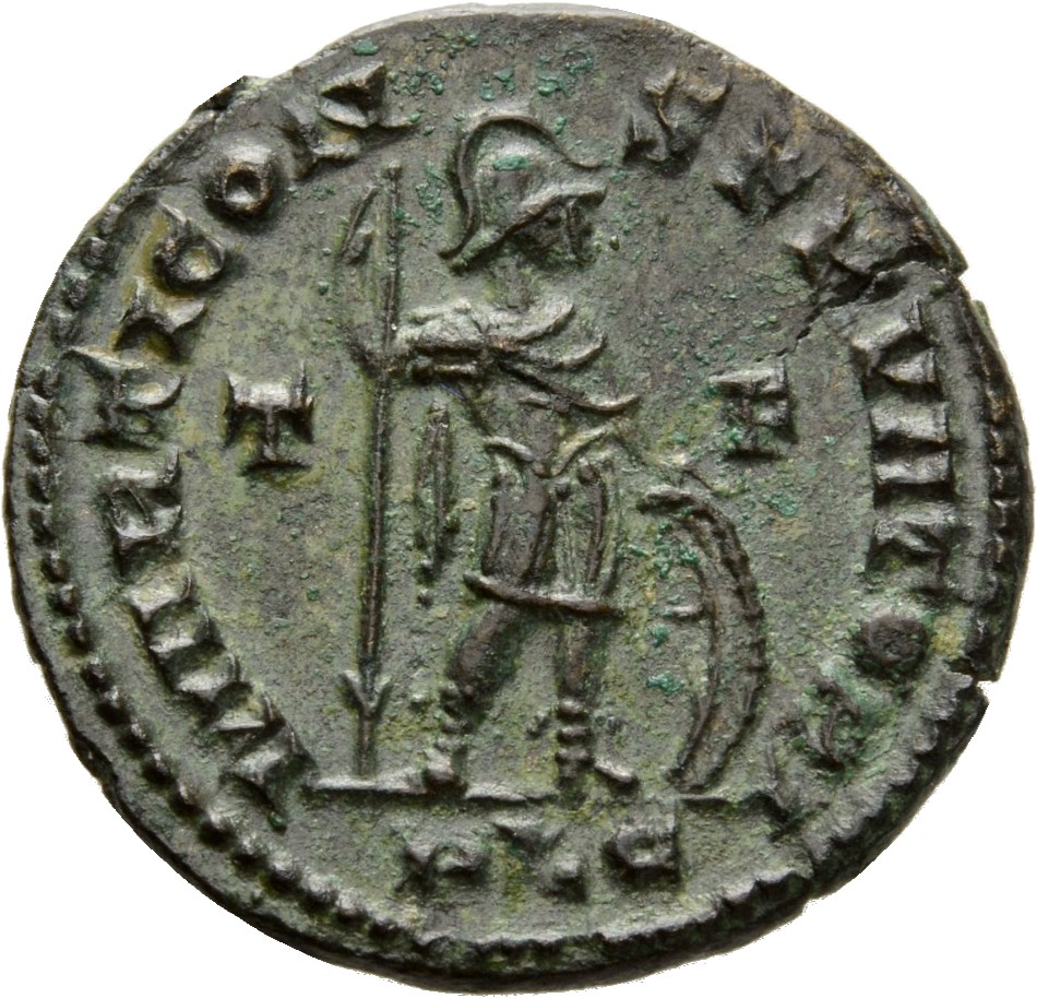 Constantine I reverse — Mars, helmeted, draped, cuirassed, standing right, holding reversed vertical spear in right hand and resting left hand on shield