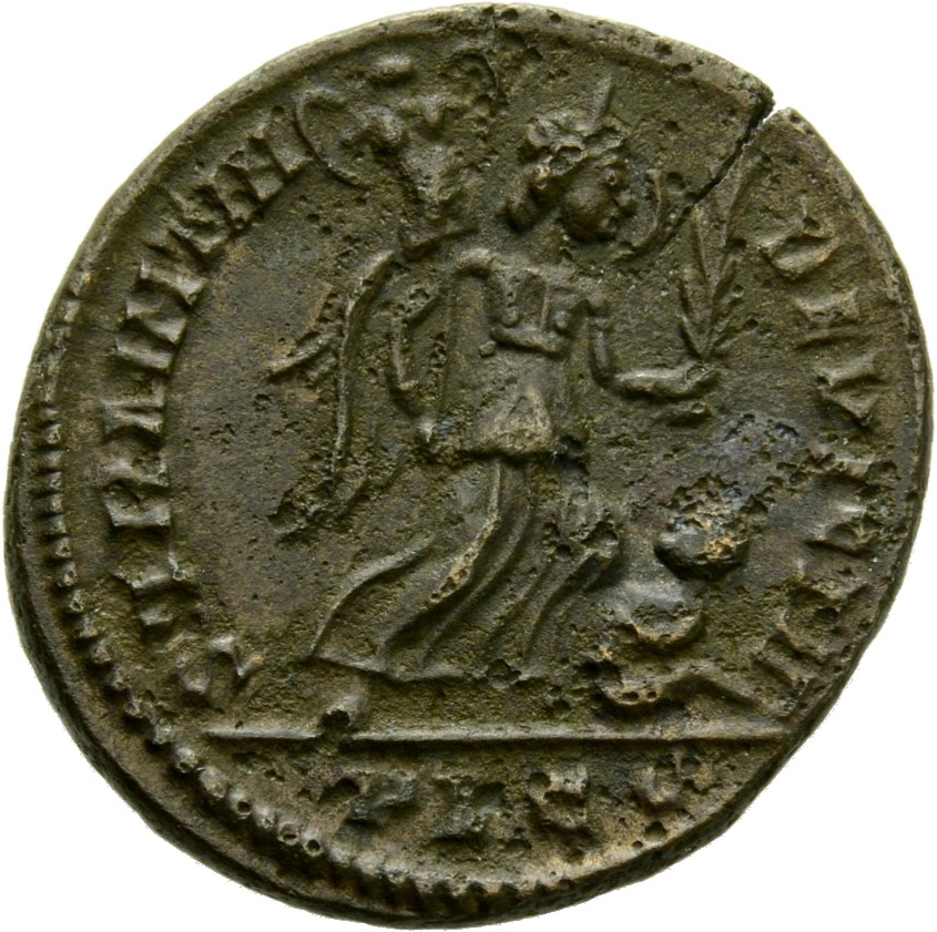 Constantine I reverse — Victory, winged, draped, advancing right, holding trophy on right arm and branch in left hand, spurning a seated captive