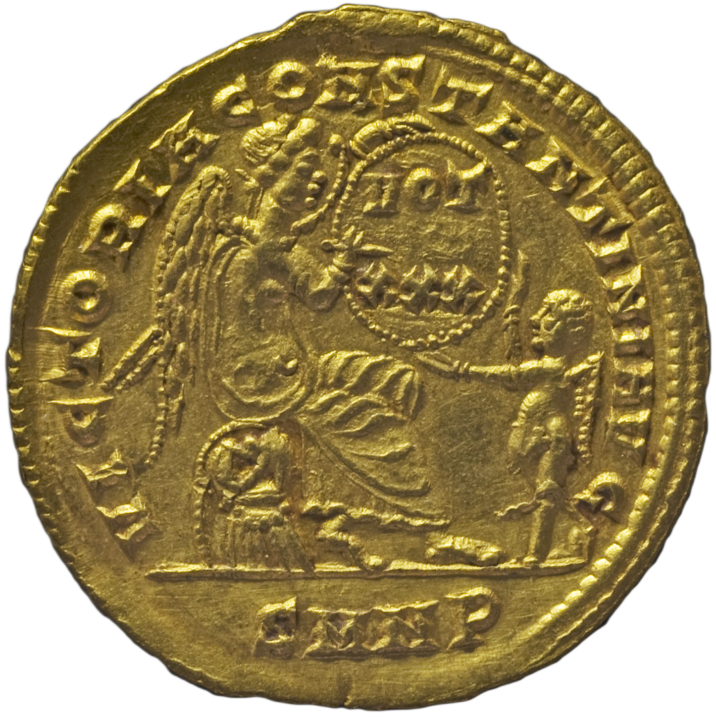 RIC VII Nicomedia 177 Constantine I reverse, Victory, winged, draped, seated right on cuirass and shield, inscribing VOT/X...