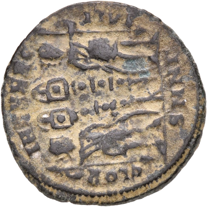 Constantine I reverse — Two soldiers, helmeted, draped, cuirassed, standing facing each other, each holding reversed spear in outer hand and resting inner hand on shield; between them, two standards