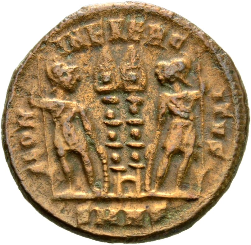 Constantine I reverse — Two soldiers, helmeted, draped, cuirassed, standing facing each other, each holding reversed spear in outer hand and resting inner hand on shield; between them, two standards
