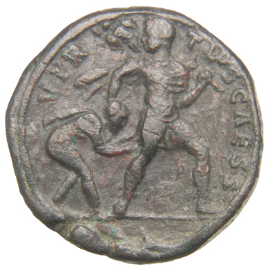 Constantine I reverse — Constantine II, draped, cuirassed, cloak flying, advancing right, dragging captive by hair with right hand and carrying trophy across left shoulder