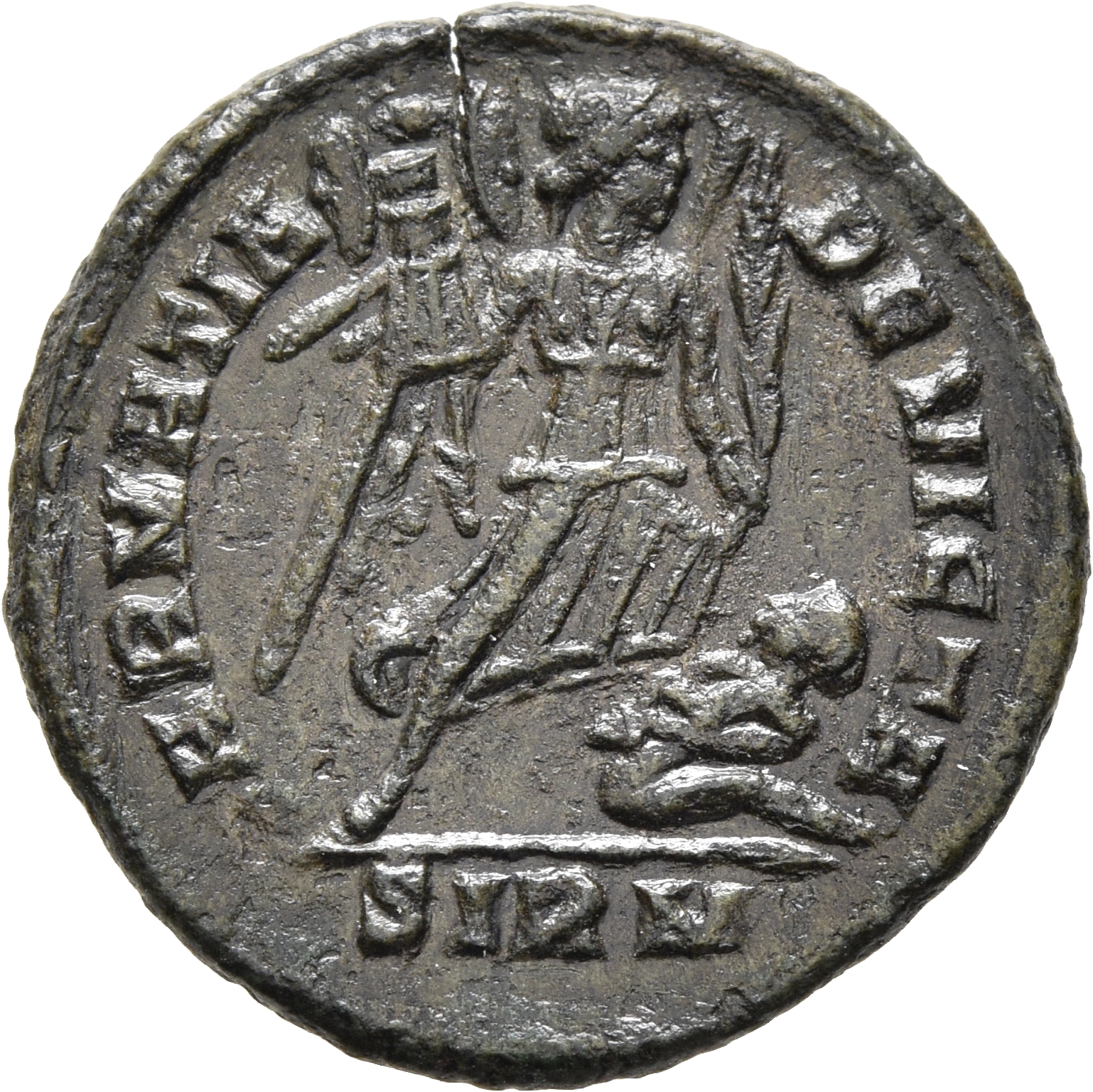 RIC VII Sirmium 48 Constantine I reverse, Victory, winged, draped, advancing right, holding trophy in right hand and spurn...