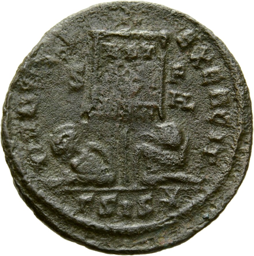 Constantine I reverse — Standard inscribed VOT/X flanked by two seated captives
