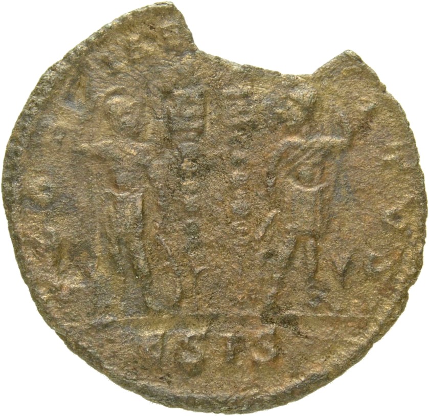 Constantine I reverse — Two soldiers, helmeted, draped, cuirassed, standing facing each other, each holding spear in outer hand and resting inner hand on shield; between them, two standards